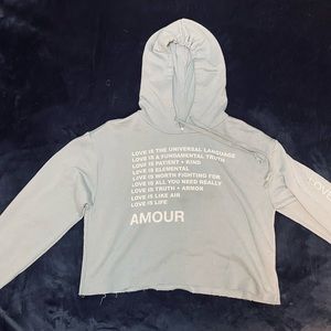 Soft light blue cropped hoodie.